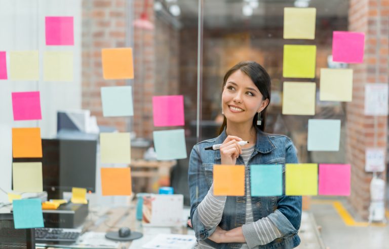 Woman thinking of ideas at the office